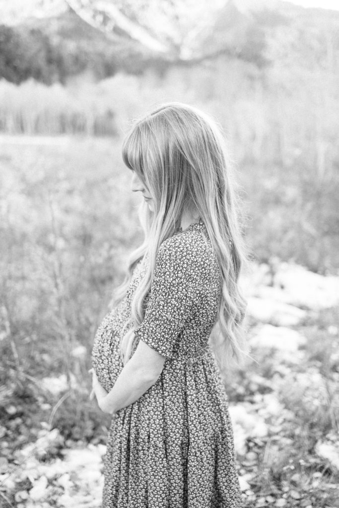 Timeless maternity photo with mama to be smiling taken by Alisa Dalton Photography. 